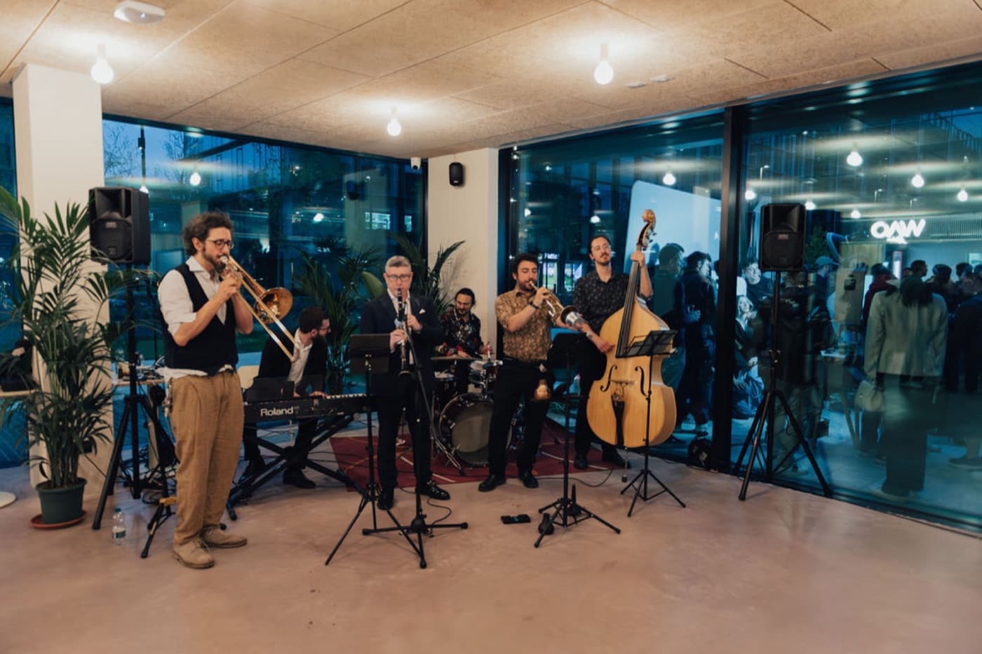 A live band playing at an evening event inside WAO Kitchen